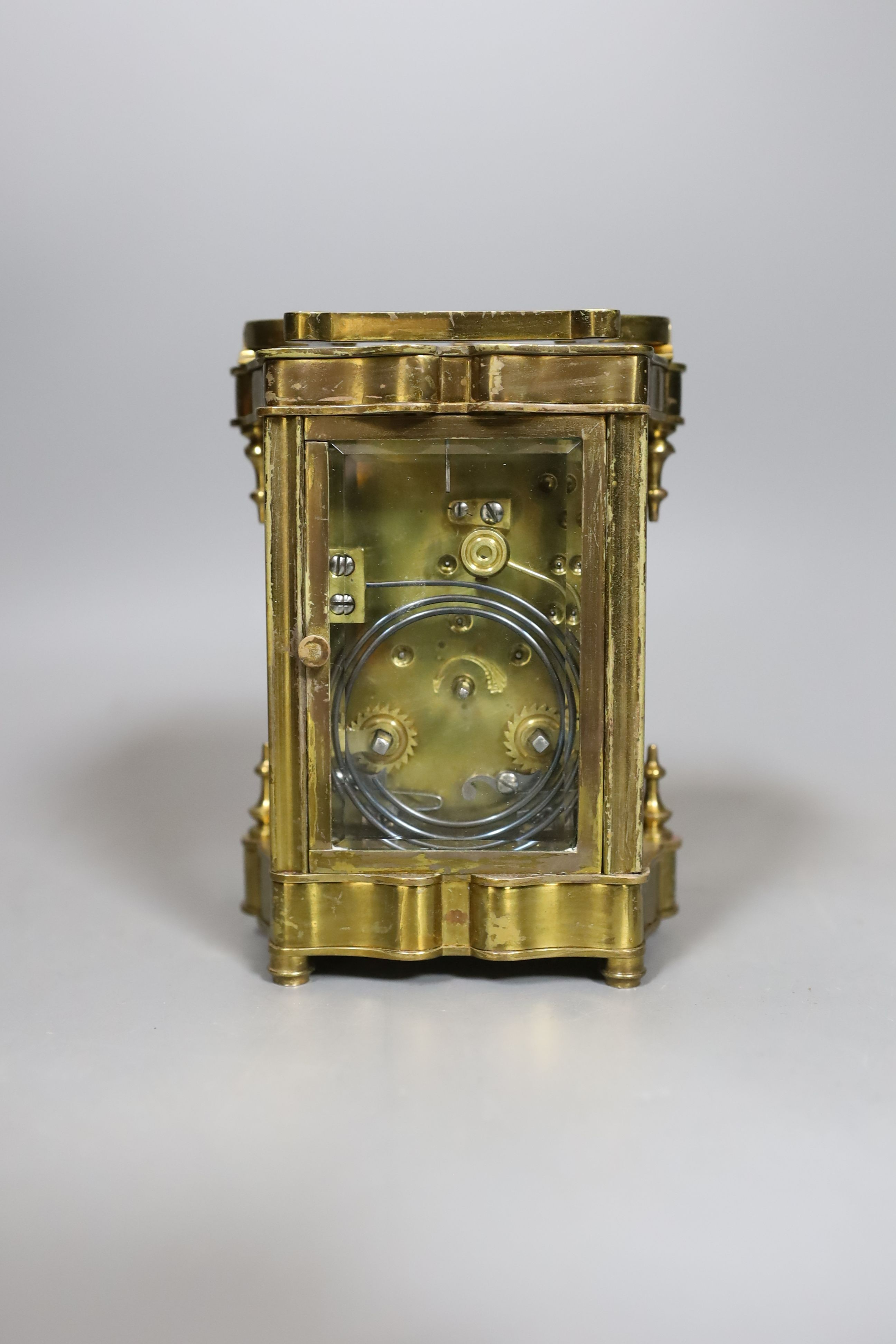 A cased brass repeating carriage clock, in case, 12 cms high.